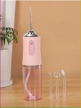 Portable Oral Irrigator Dental Flosser with 4 Nozzles shown from another angle (Fitness & Health)