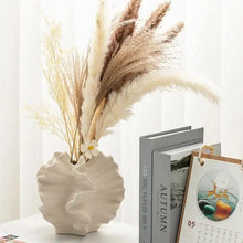 Minimalist Art Irregular Decoration White Shell Shape Matte Clay Ceramic Vase shown from another angle (Ceramic)