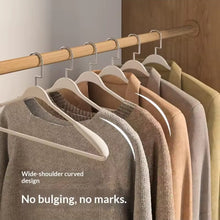 New Arc-Shaped Thickened Clothes Hanger – 10PC Set shown from another angle (Black & Cream)