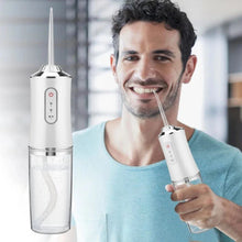 Portable Oral Irrigator Dental Flosser with 4 Nozzles shown from another angle (Fitness & Health)